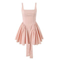 Product shot blush pink square neck skater mini dress, fitted bodice, gathered flare skirt, long hanging back tie sash, isolated white background