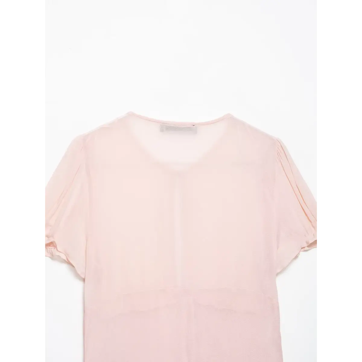  Full back view of the blush pink V-neck puff sleeve blouse.