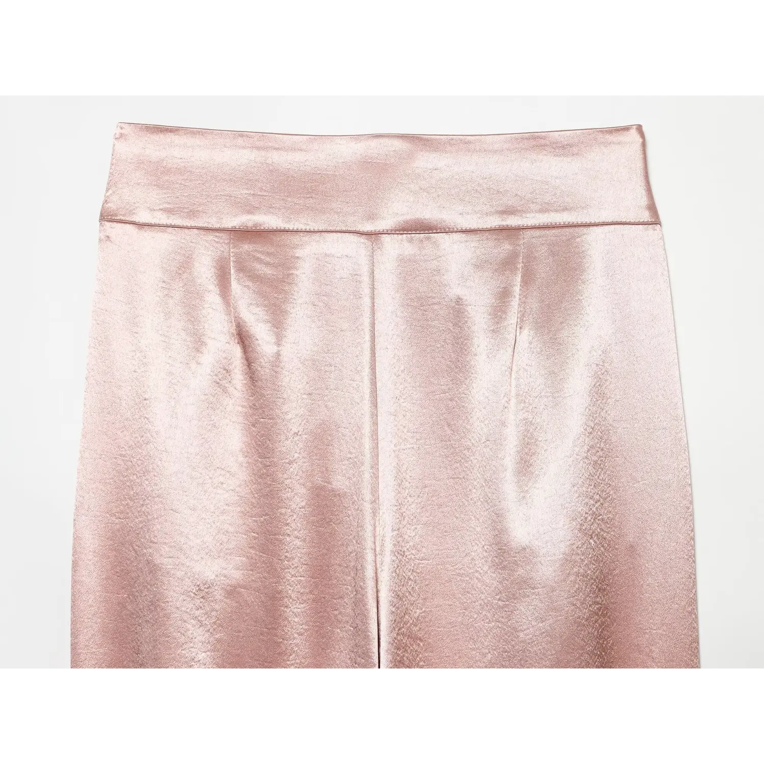 Flat lay back view high waistband and back seam detail of blush pink satin tapered pants