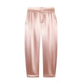 Flat lay front view blush pink textured satin tapered trousers with pleated waist and side pockets