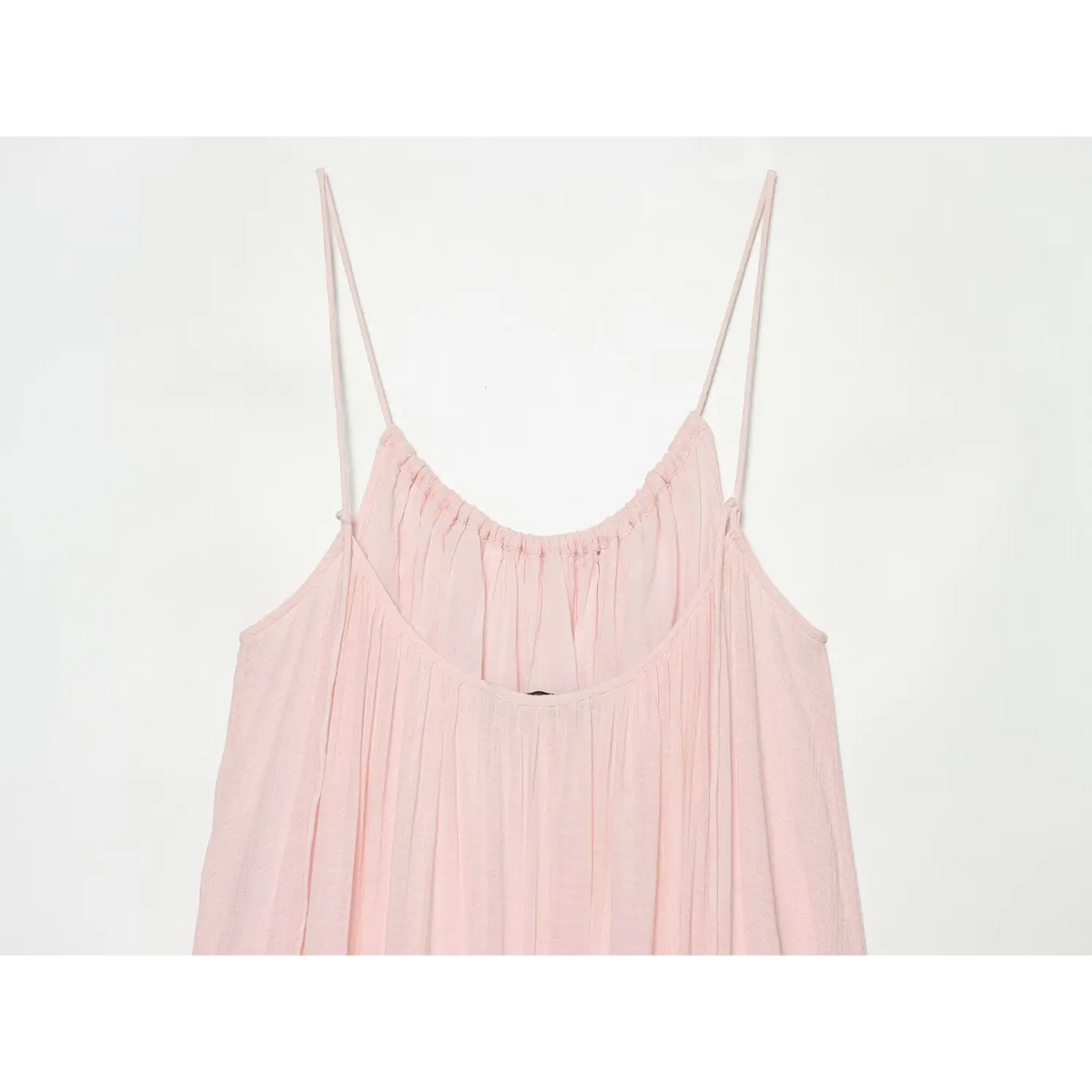 Partial back view of scoop neck and thin spaghetti straps