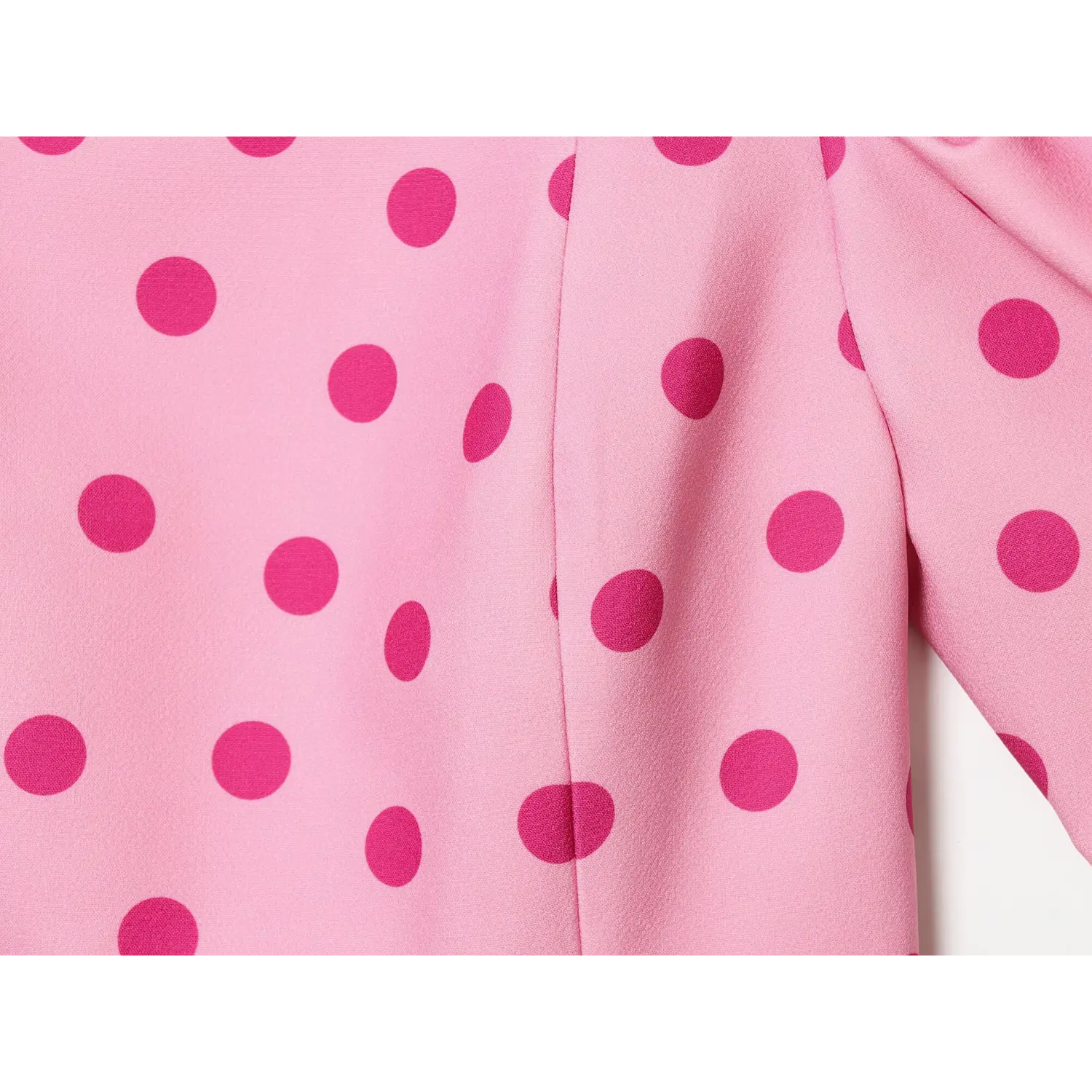 Full bottom view flared peplum hem with vertical side splits and tailored seams