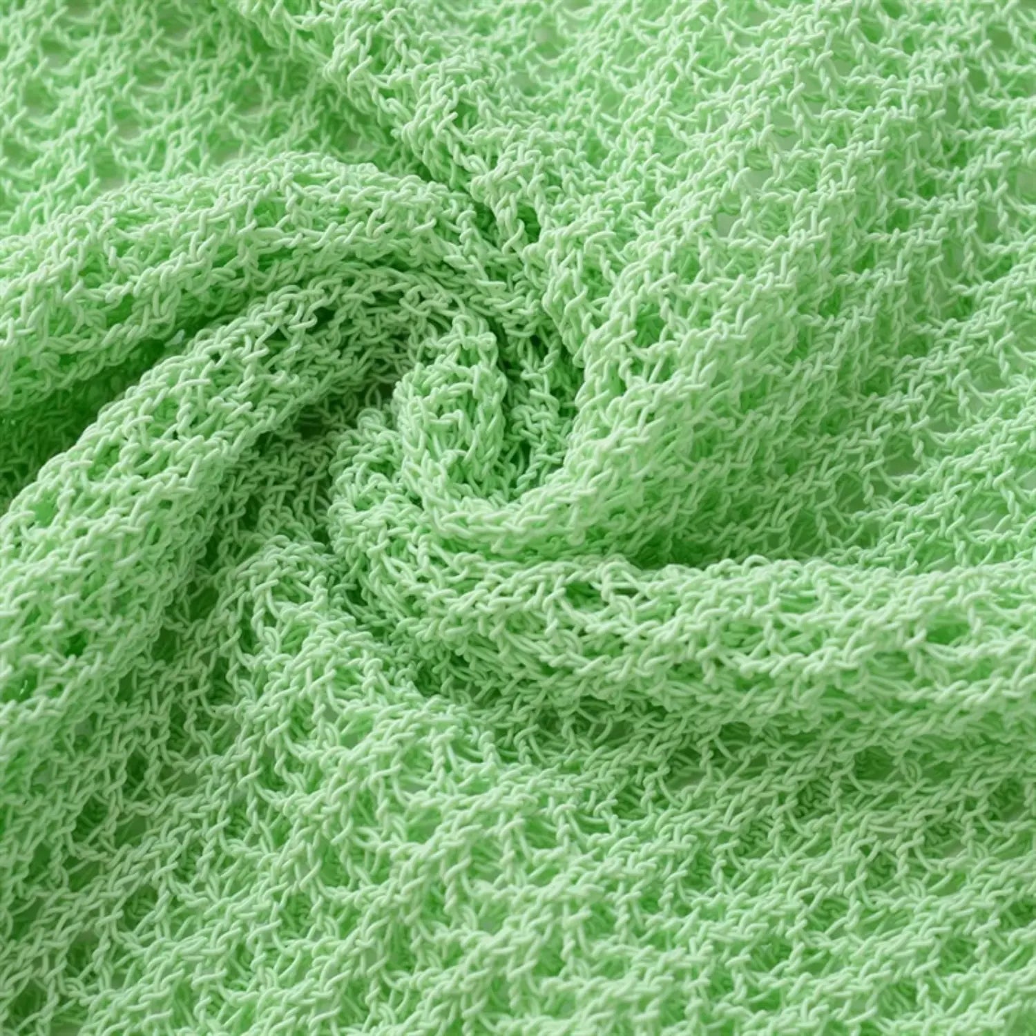 Body fabric close-up, light mint green openwork knit, visible yarn loops, mesh structure, soft casual summer knit texture