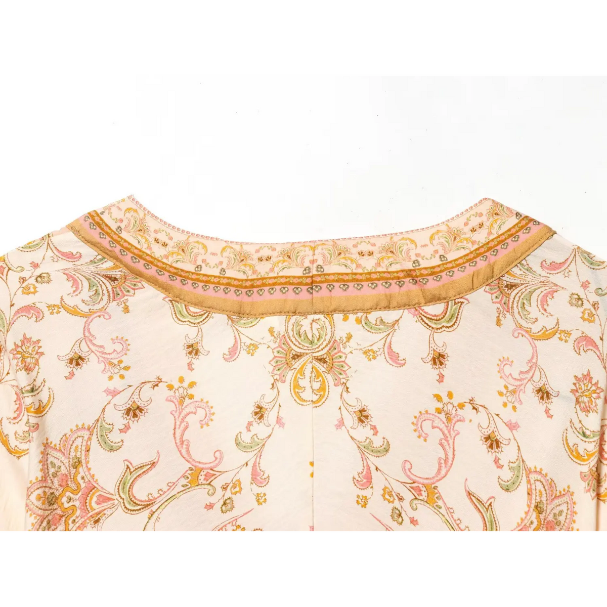 Flat lay close‑up of back neckline and yoke vintage paisley floral print