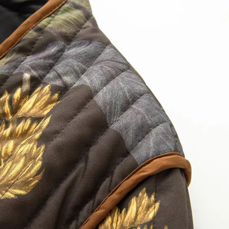 Macro close-up of quilted shoulder and botanical print