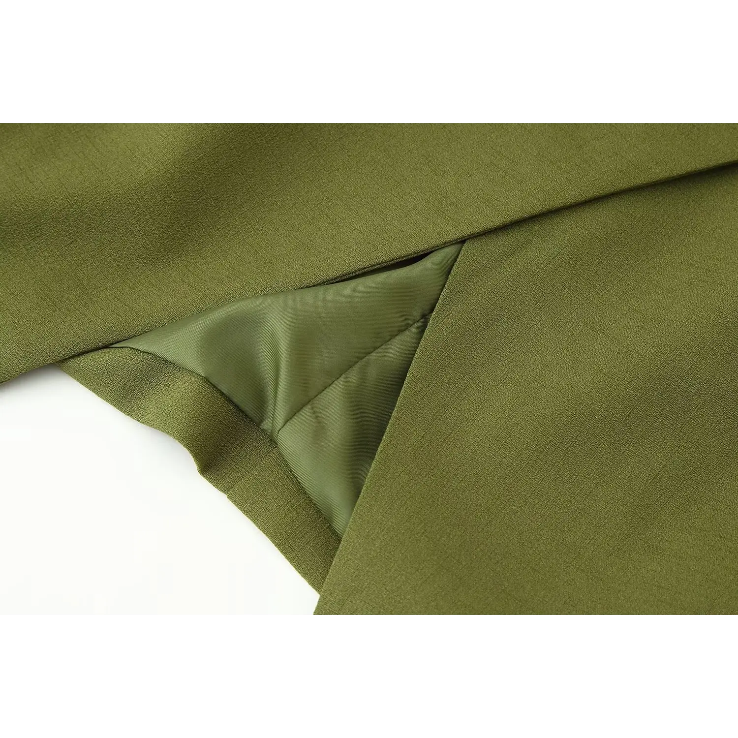 Front hem split partial shot, folded front hem, exposed smooth inner lining, tailored finished edge