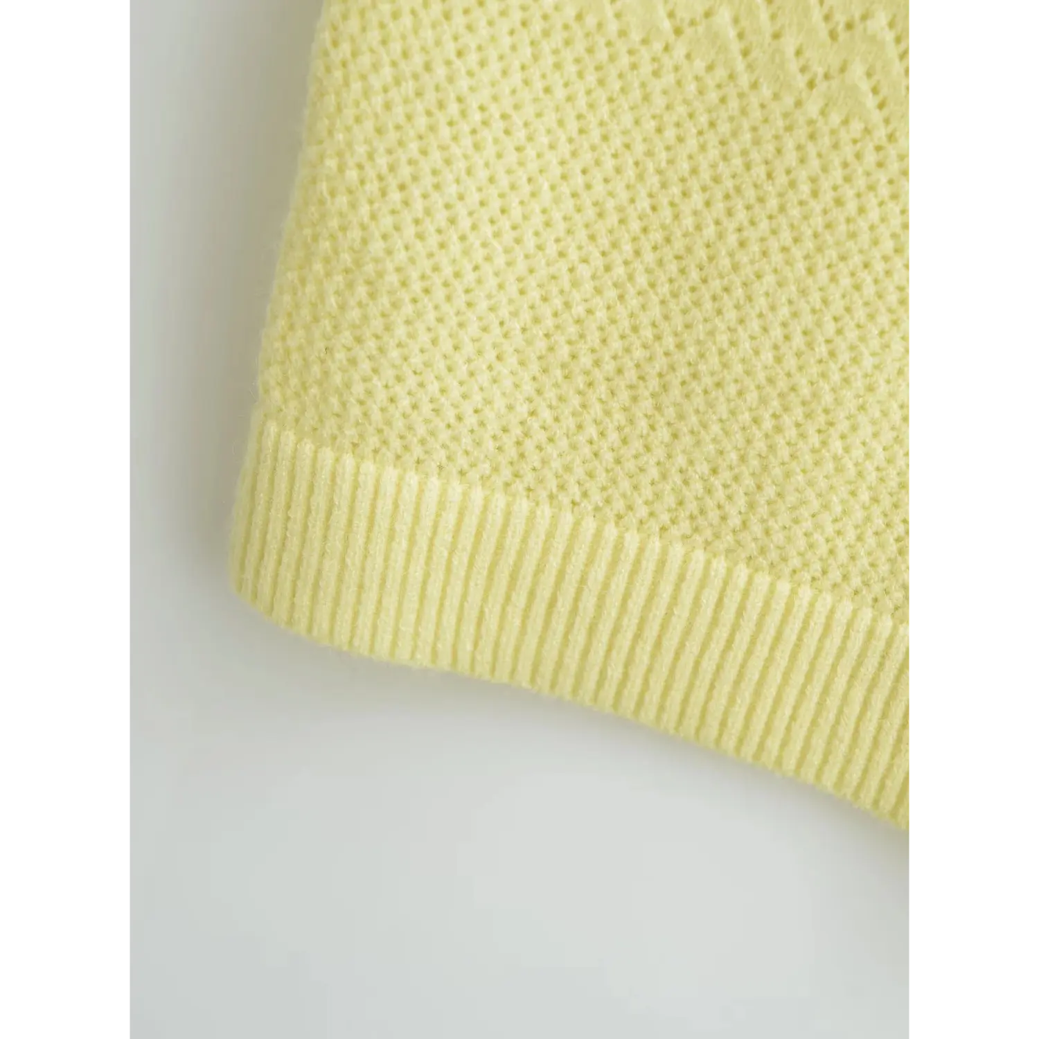 Detail view solid ribbed hem band for shaping