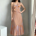 Model wearing summer vertical stripe cami midi dress, orange & light blue stripes, large chest bow, flounce hem slip dress