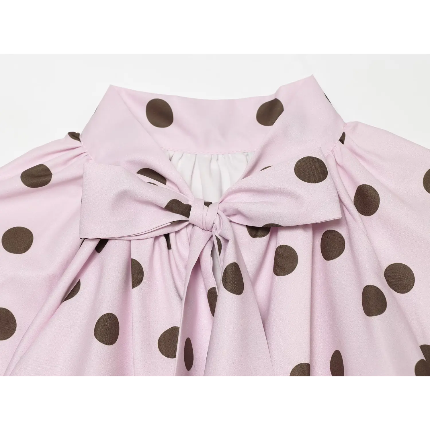 Bow tie neck macro close-up, self-fabric bow knot, back opening lining detail, polka dot blouse