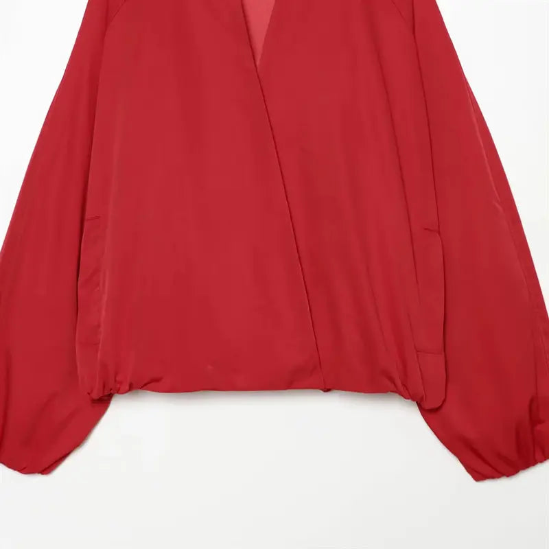 Waist closeup elastic gathered bottom hem, side slit pocket opening, smooth matte woven outer fabric