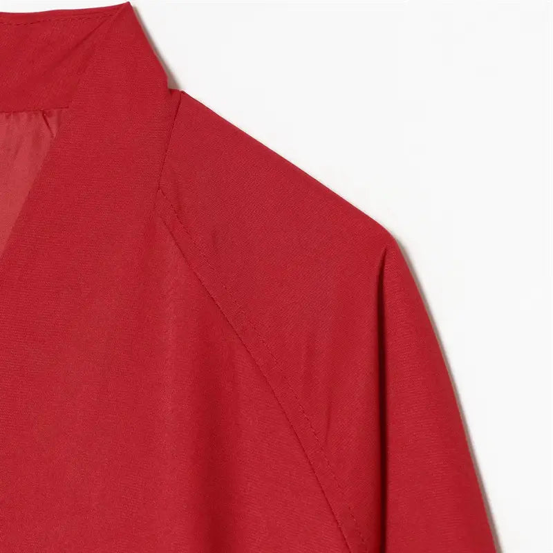 Shoulder closeup diagonal raglan stitching, wrap stand collar inner lining construction