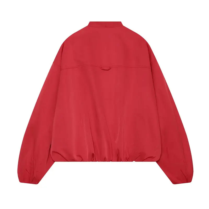 Back flat lay bright red wrap front cropped jacket, stand inner collar, back hanging tab, elastic bubble cuffs & hem, raglan sleeves