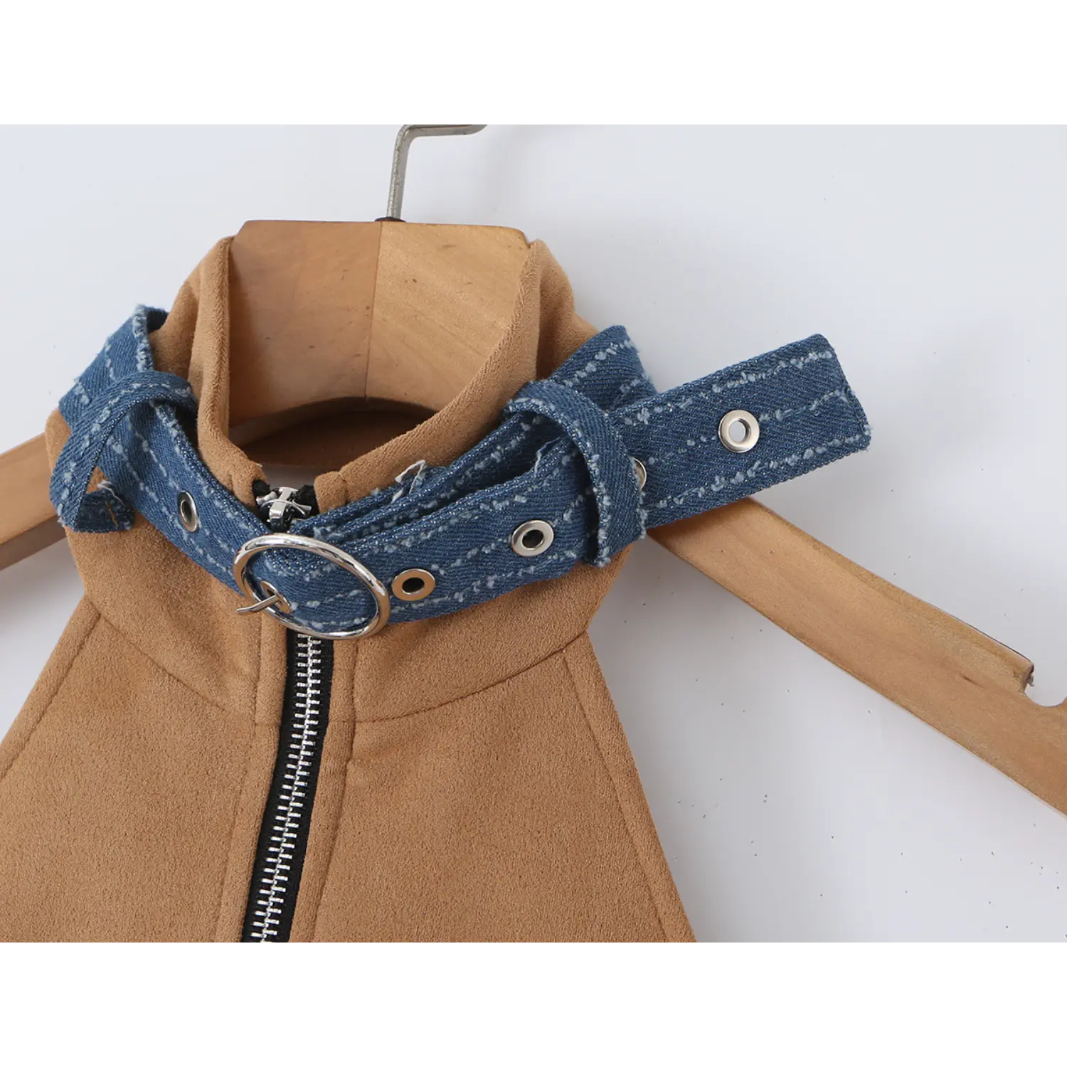 Close-up shot of the denim halter collar with metal eyelets and buckle detail