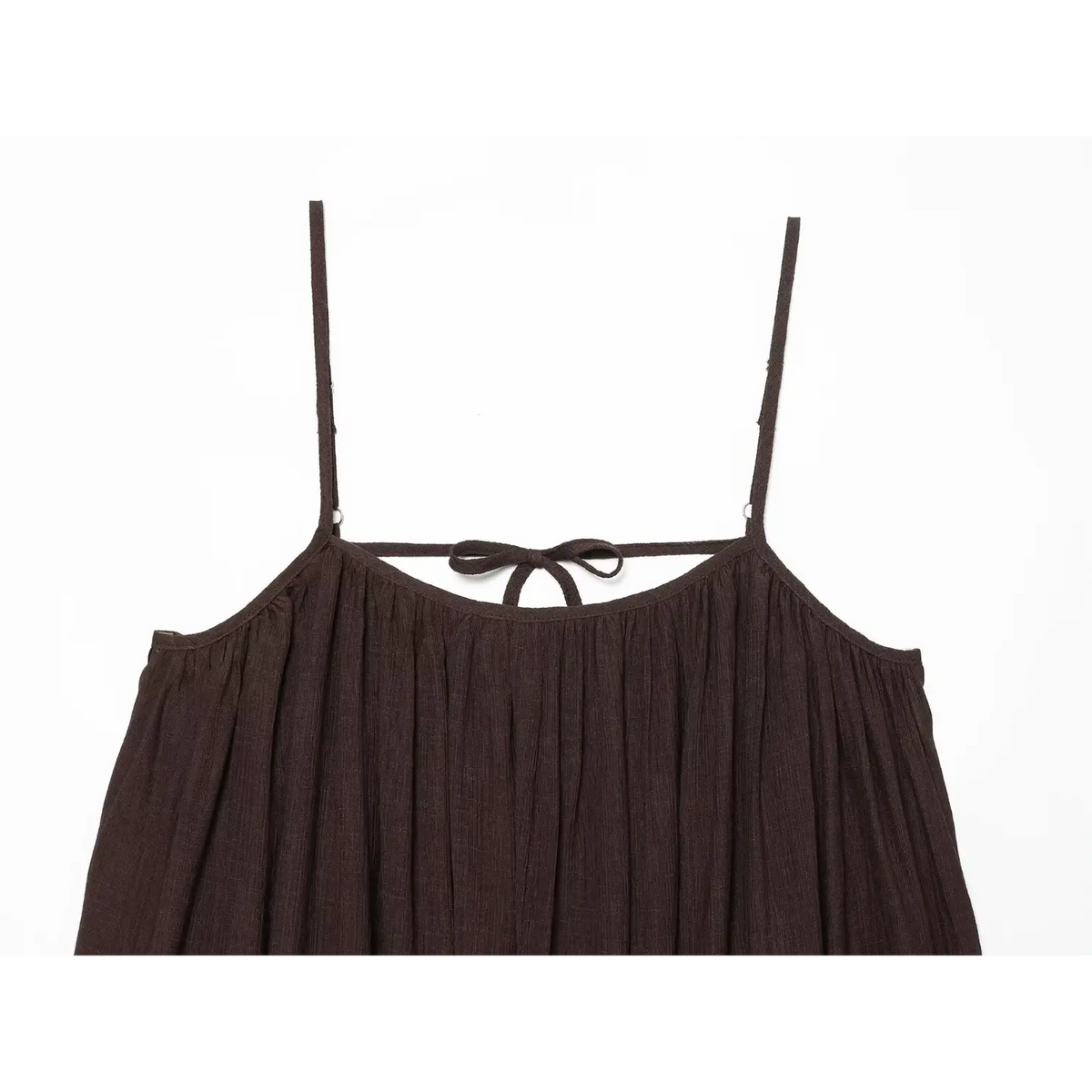 Close‑up back bodice of brown loose cami dress, gathered neckline, back tie bow, crinkle woven fabric