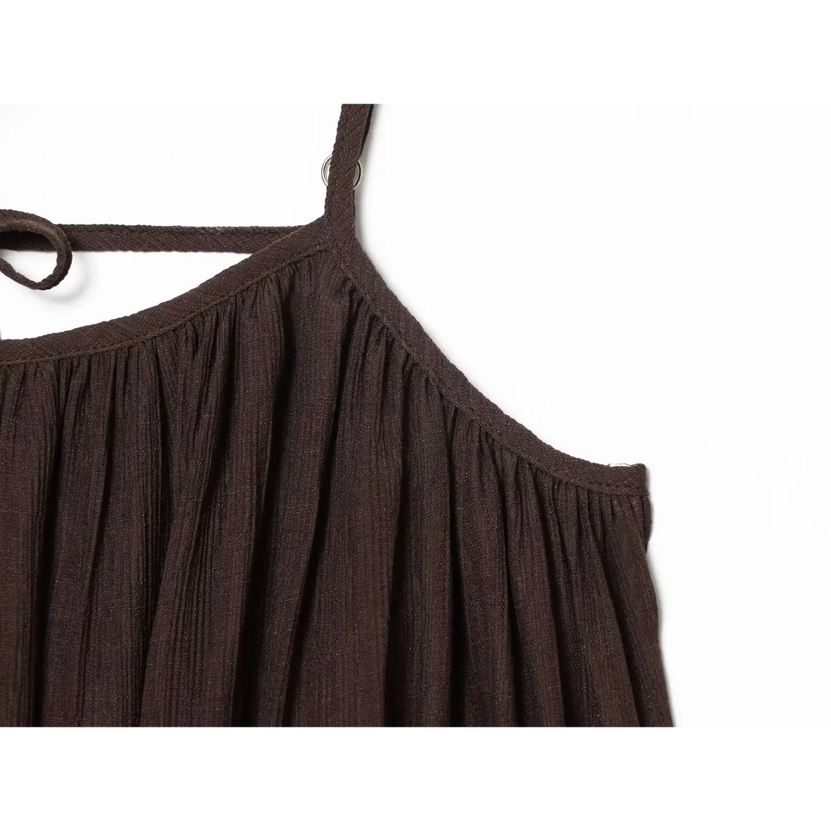 Close‑up shoulder gathered seam and strap attachment detail of brown loose cami dress