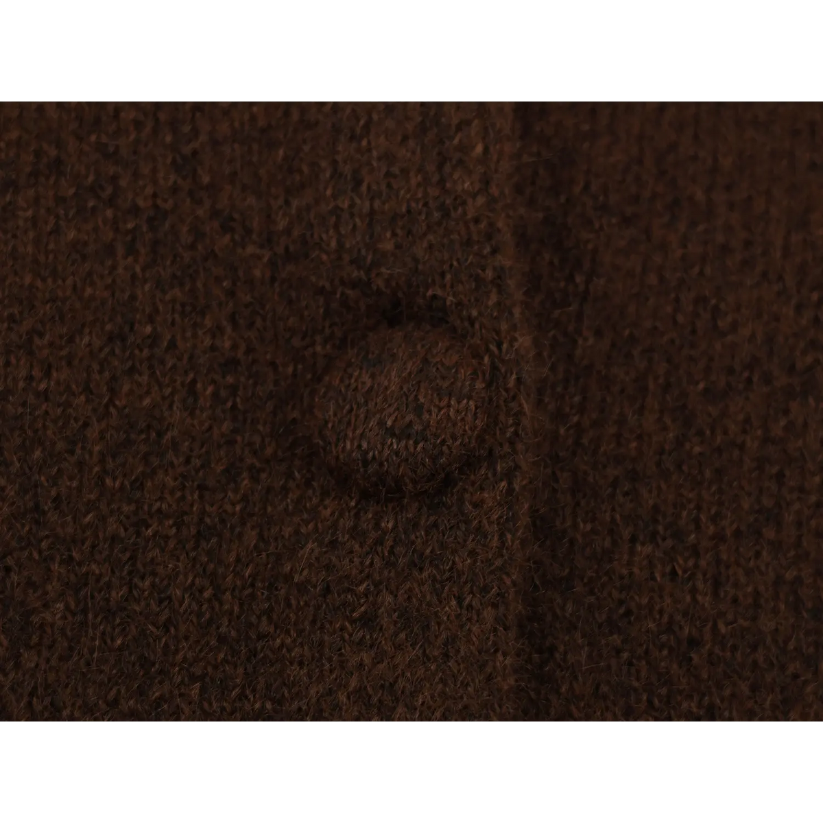 Close-up of fabric-covered button