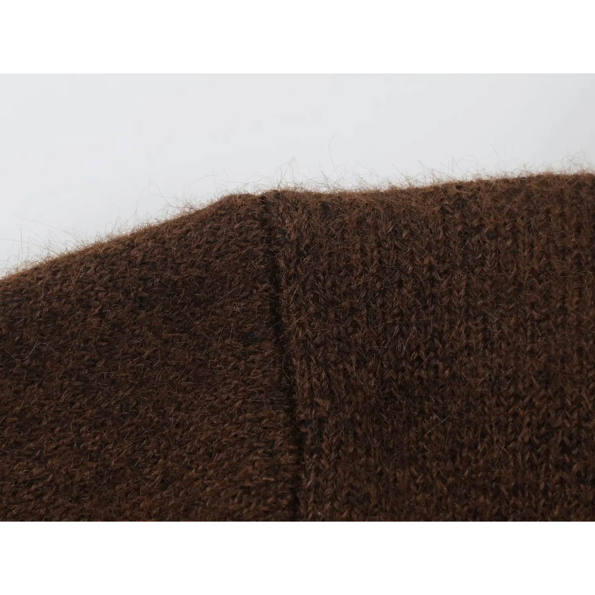 Close-up of fuzzy knit shoulder seam