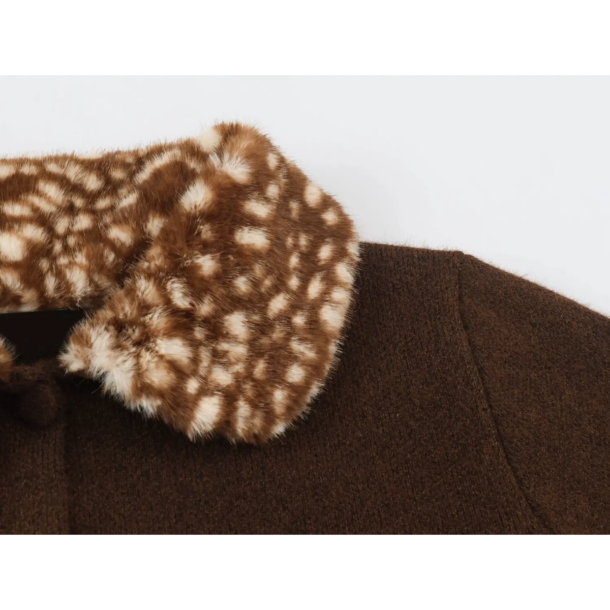 Close-up of shoulder and faux fur collar