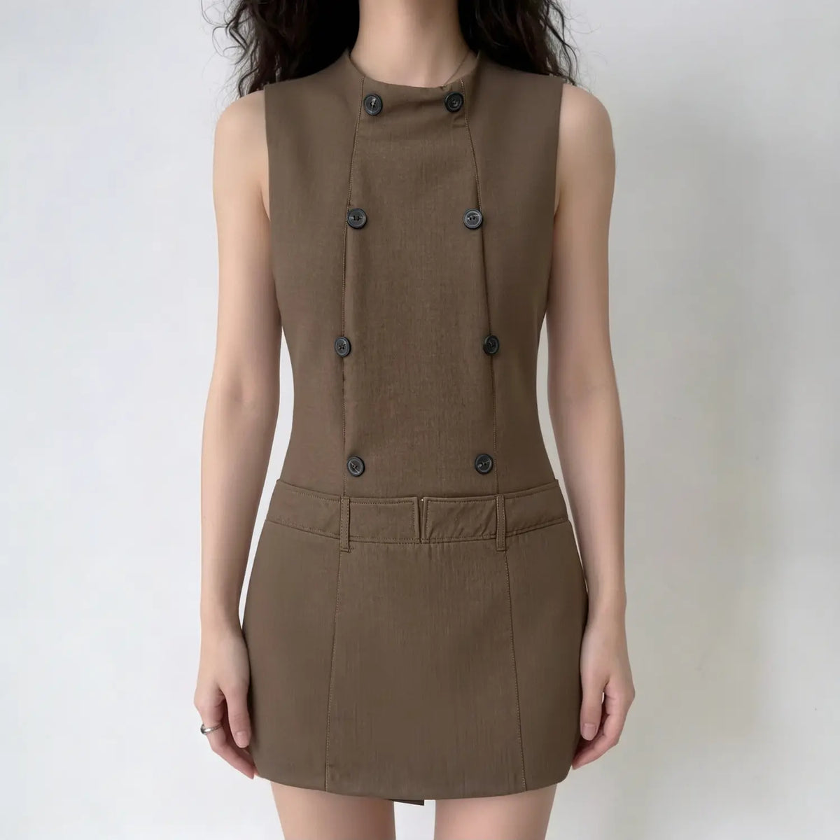 Model wearing brown stand collar double breasted sleeveless mini dress