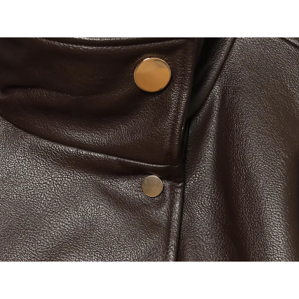 Close-up of stand collar and gold metal buttons