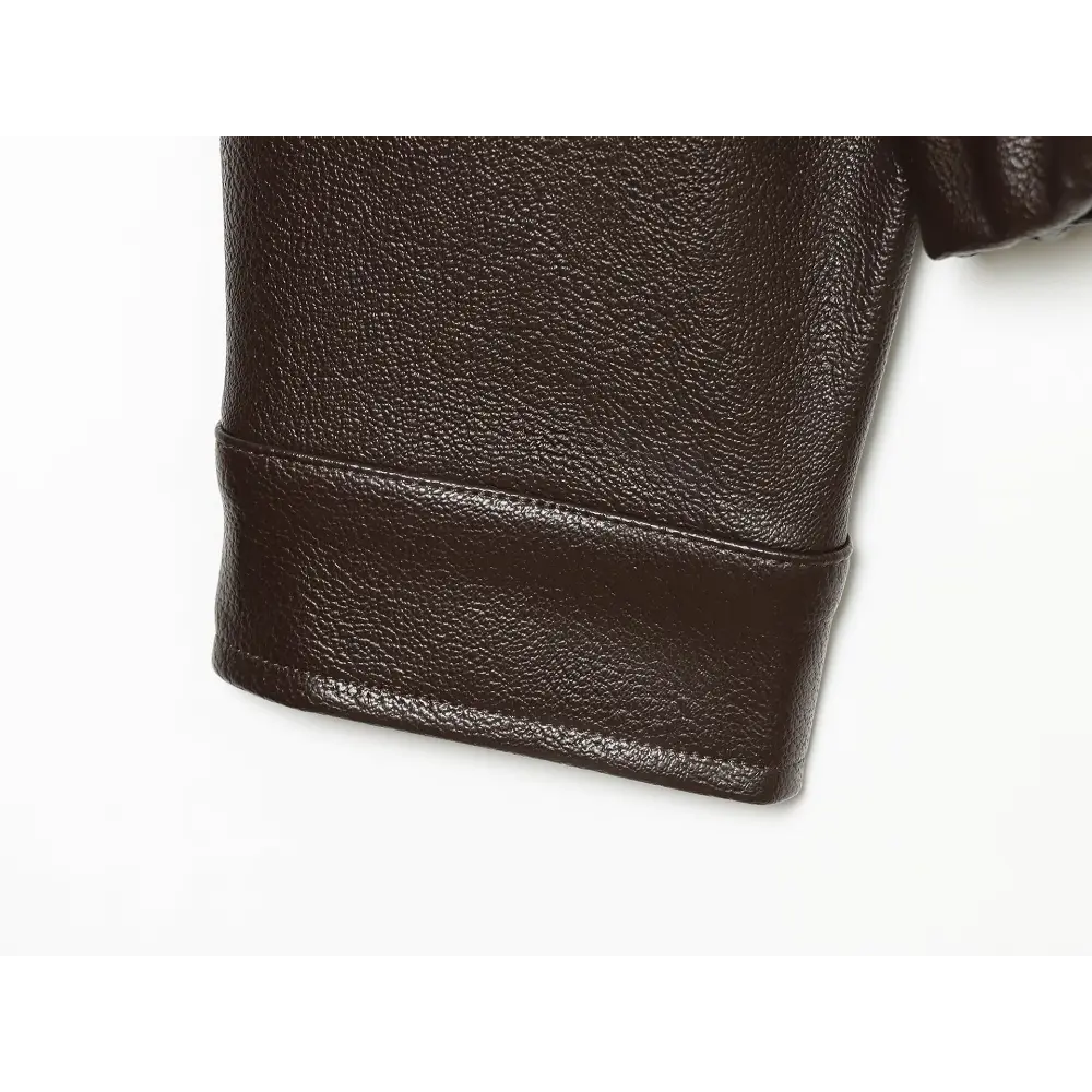 Close-up of faux leather cuff and stitching