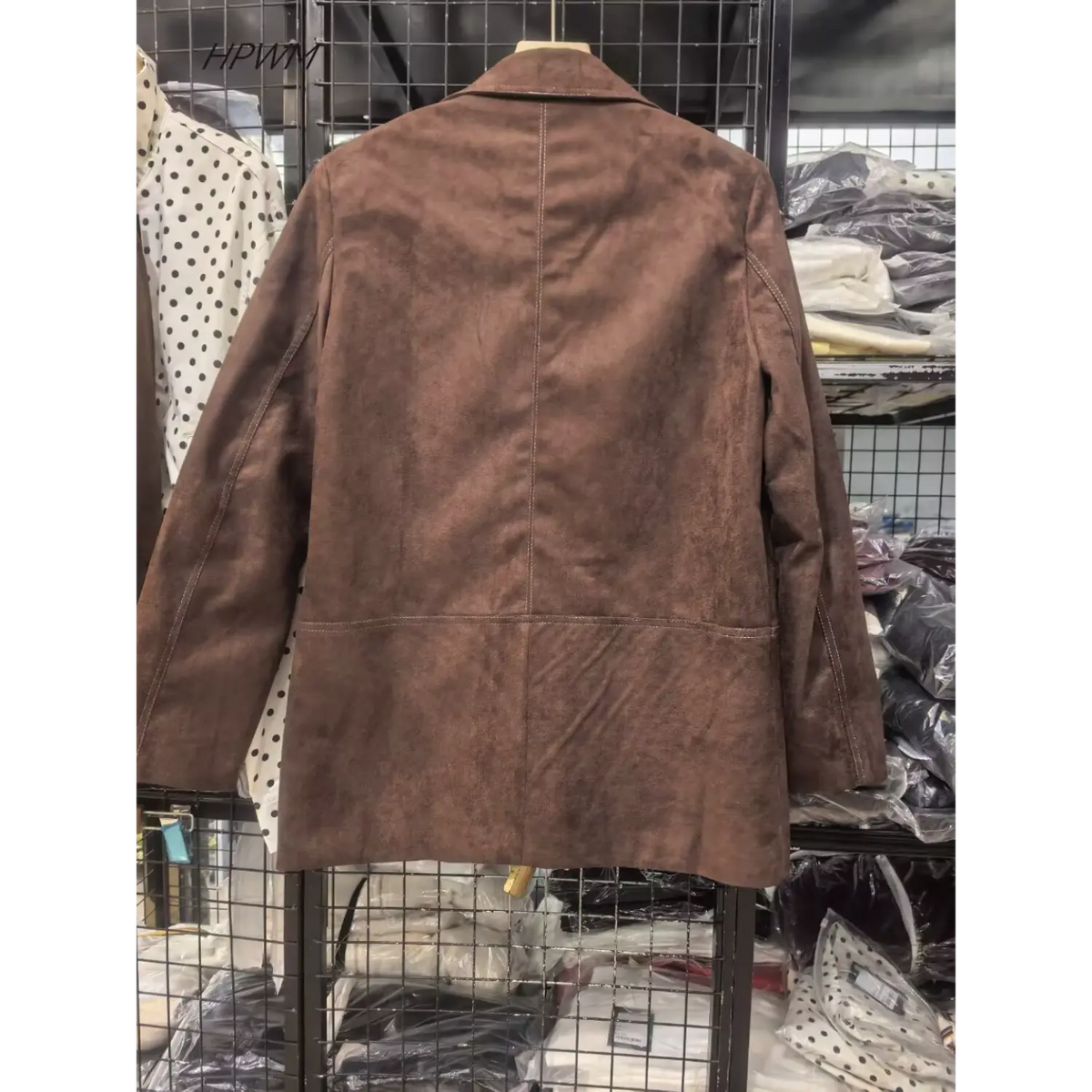 Brown faux suede blazer on hanger, back view