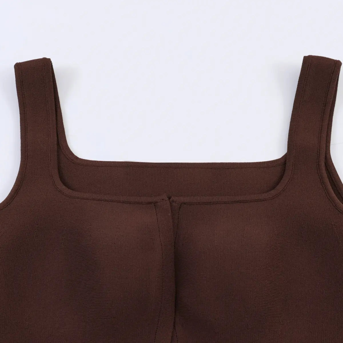 Close-up of the square neckline and fitted silhouette on the brown knit tank top