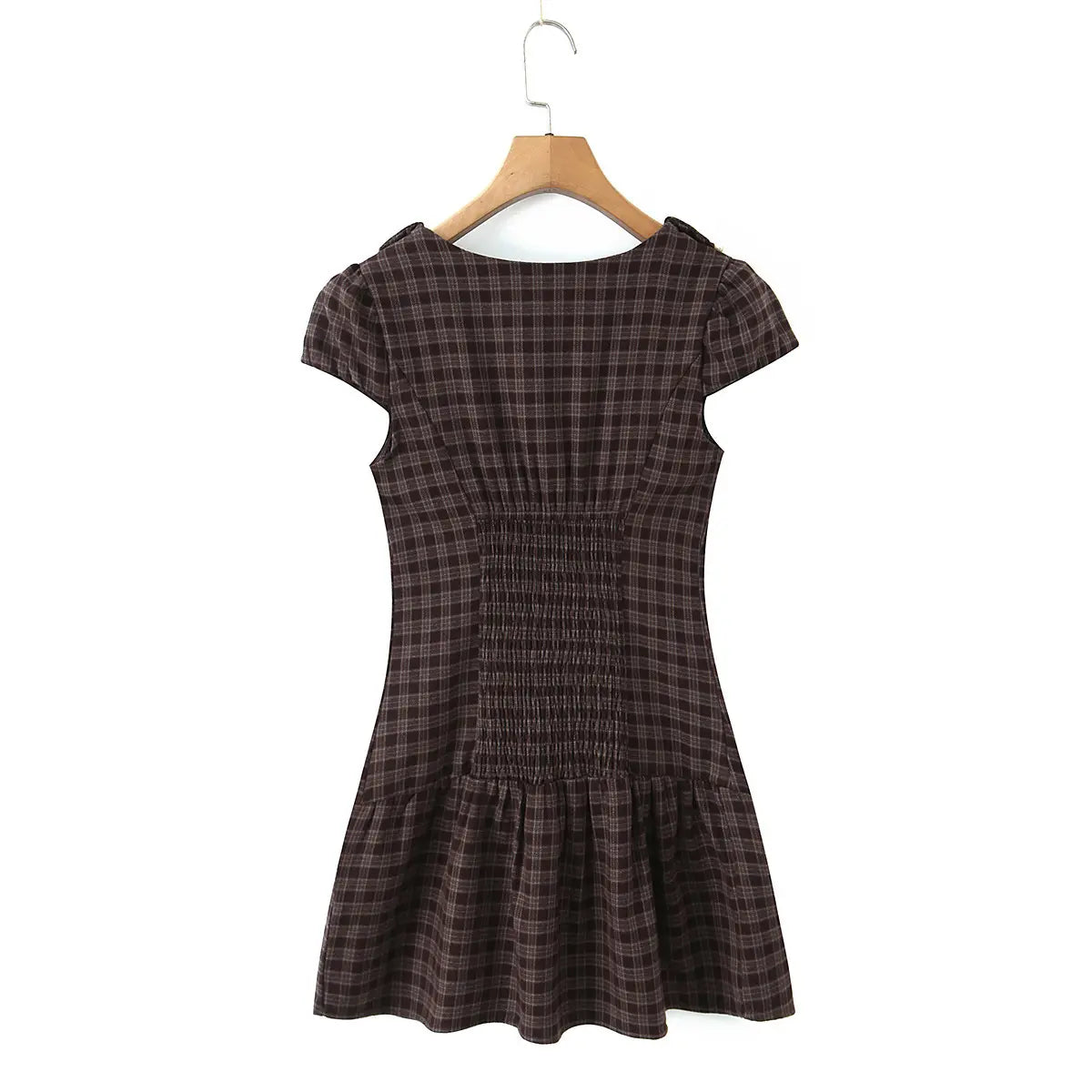 Full back view of the dress, highlighting the smocked waist panel and silhouette.