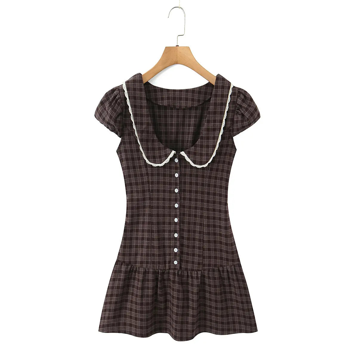 Full view of the dress on a hanger, showcasing the Peter Pan collar, puff sleeves, and ruffled hem.