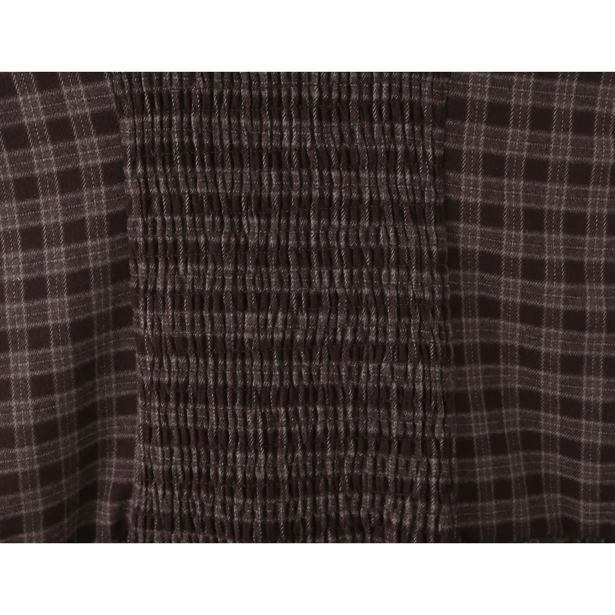  Close-up of the elasticated smocked panel at the back waist, designed for comfort and fit.