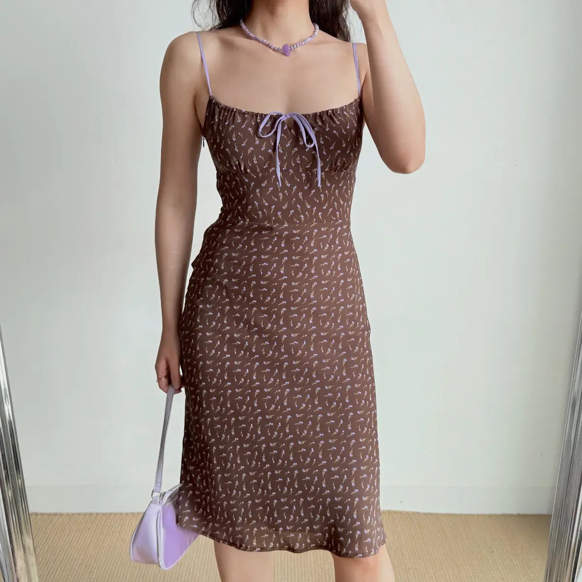 The complete outfit featuring the brown floral midi dress, lavender accessories, and styling.