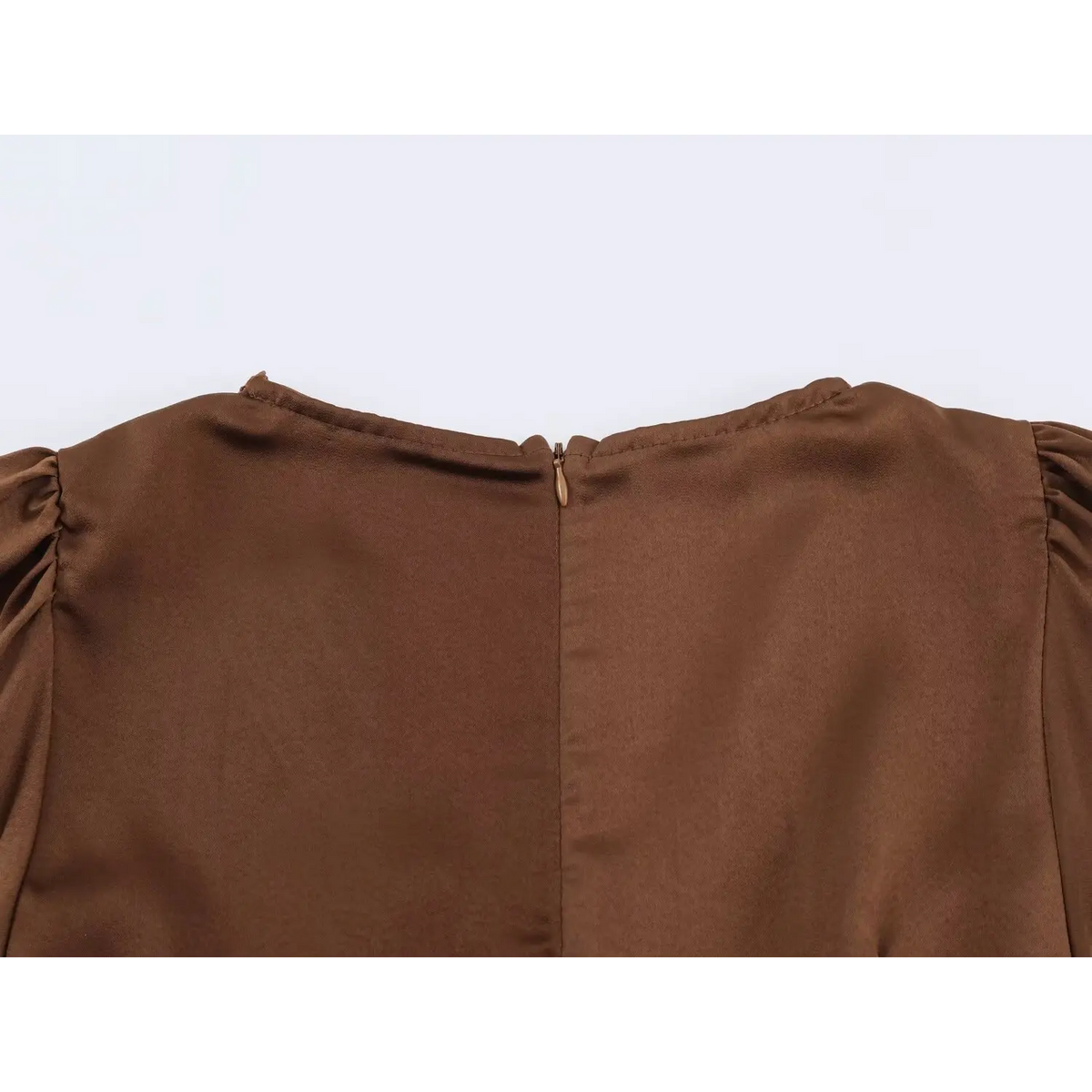Close‑up back neck invisible zipper of brown satin maxi dress