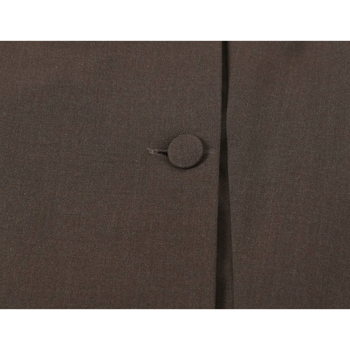 Close-up of matching fabric button