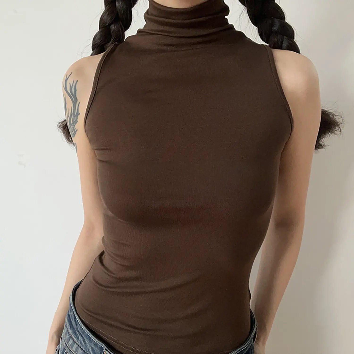 Front torso model shot, chocolate brown sleeveless turtleneck tank top, bodycon knit top