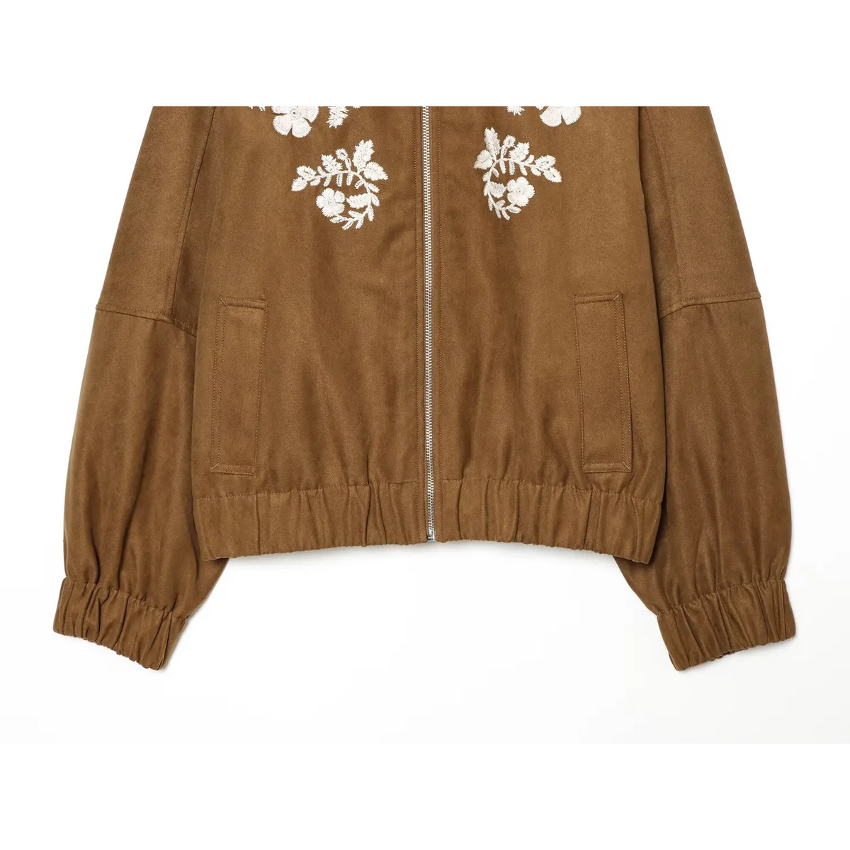 Lower front view of brown faux suede embroidered bomber jacket, showing patch pockets and elastic hem