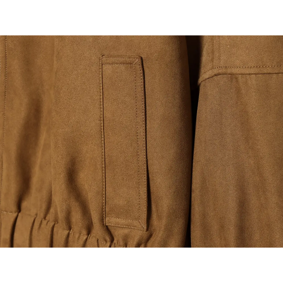 Close-up of rectangular stitched patch pocket on brown faux suede bomber jacket