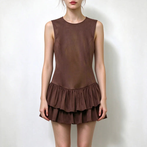 Model wearing brown suede sleeveless round neck mini dress with double tier ruffle hem, plain white background