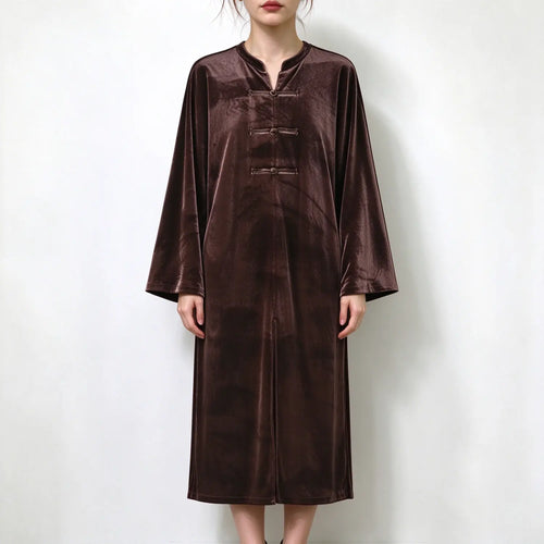 Model wearing brown velvet frog button midi dress, front view