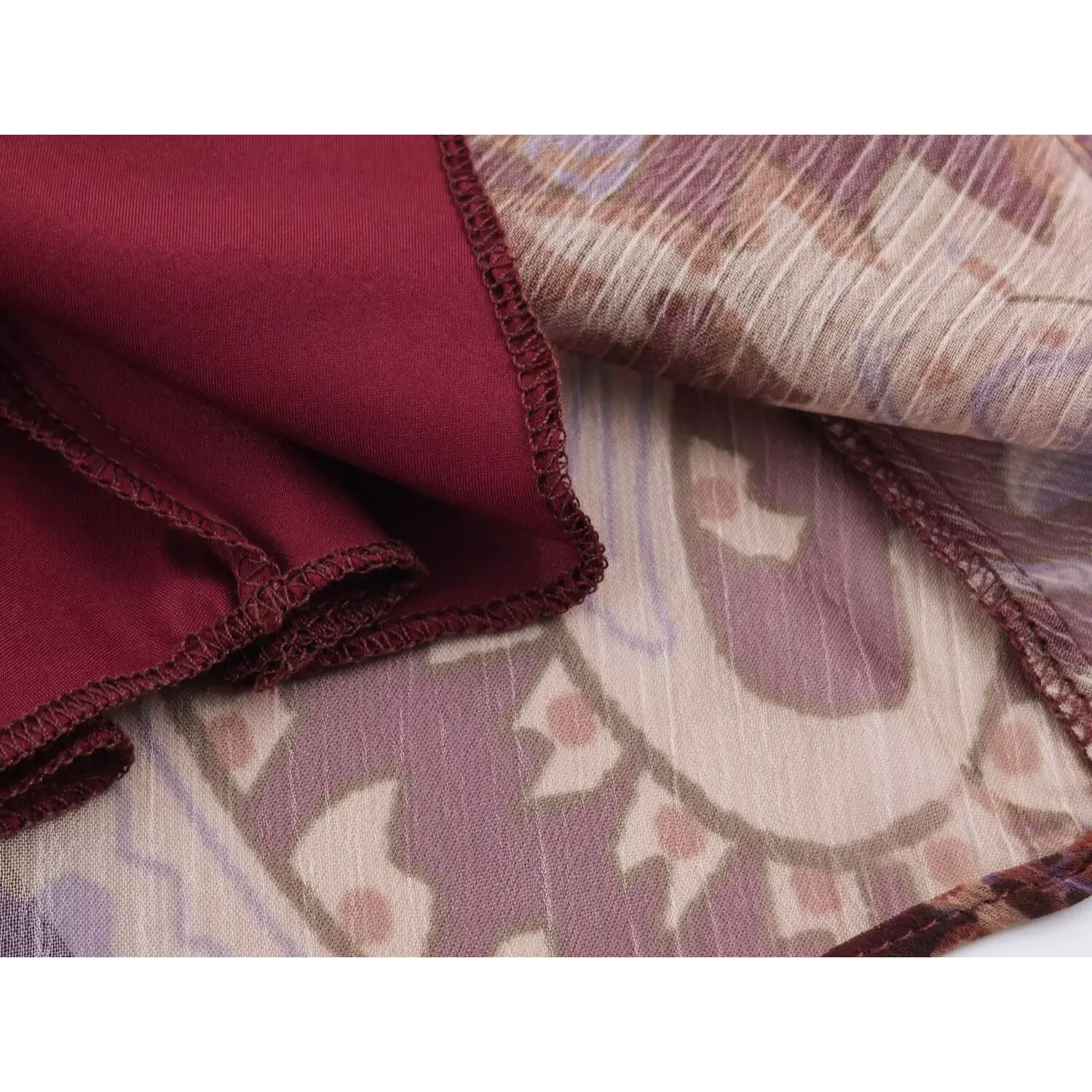 Detail of inner lining and neat hem stitching for burgundy boho dress