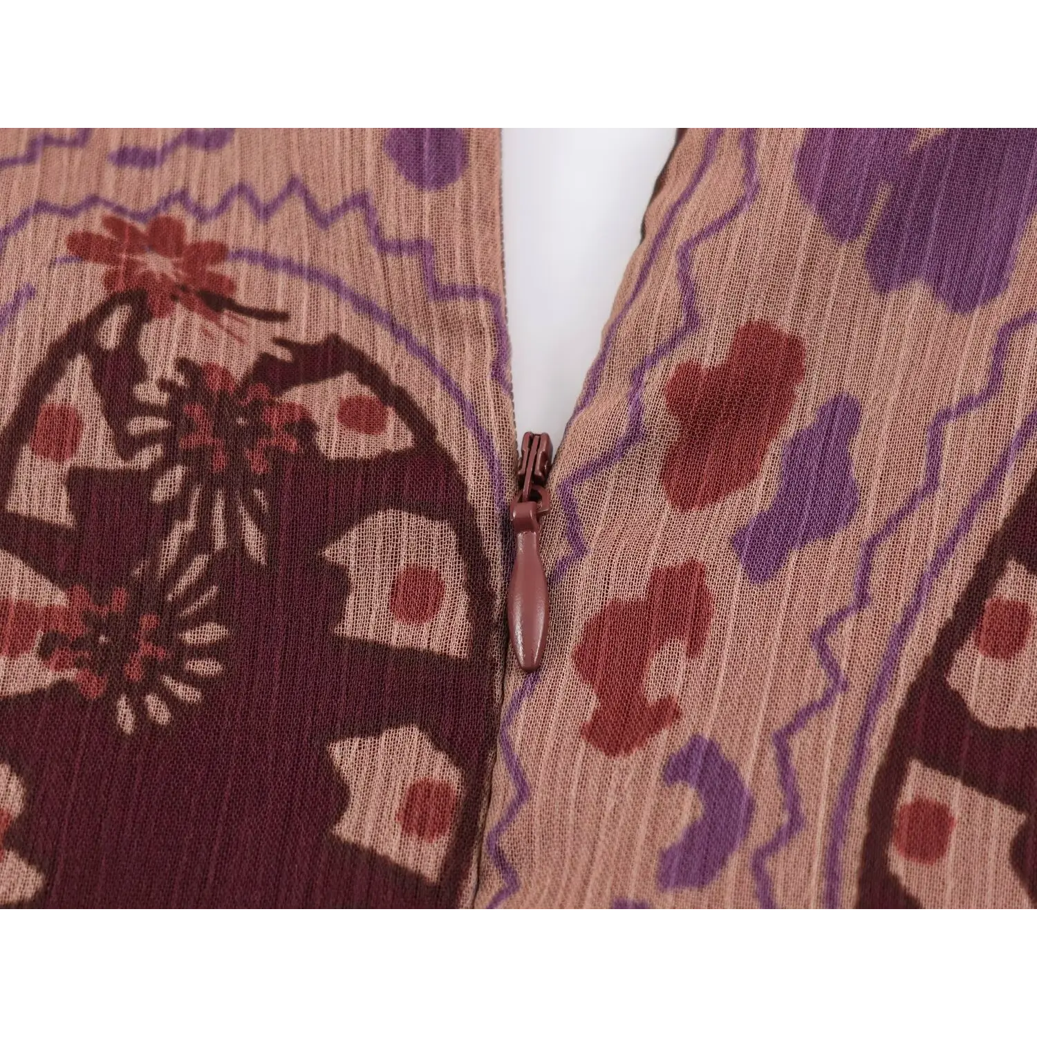 Macro shot of burgundy color matching hidden back zipper