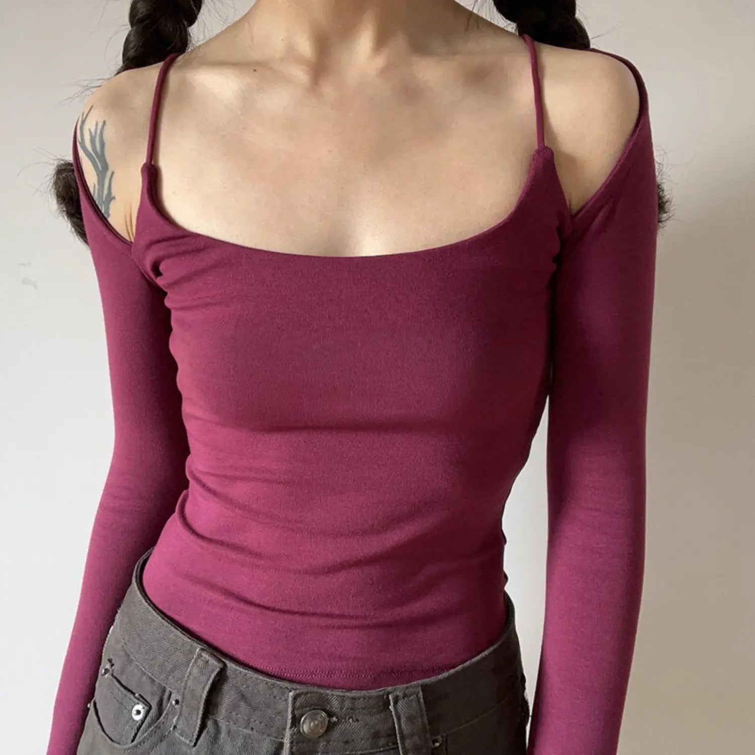 Burgundy spaghetti strap fake two piece cold shoulder long sleeve top half body indoor shot, square neck slim waist cropped fit, double braid girly retro soft styling