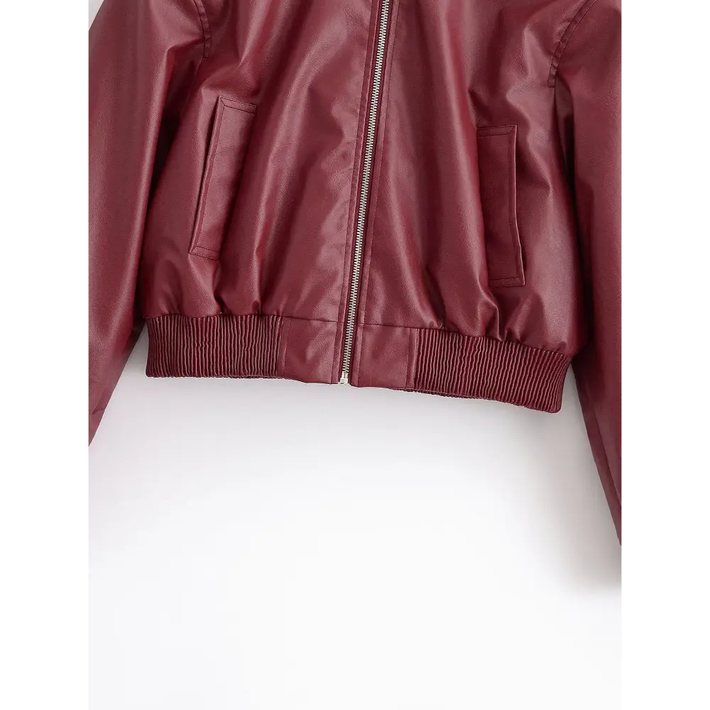 Close-up of ribbed hem, welt pockets and front zip