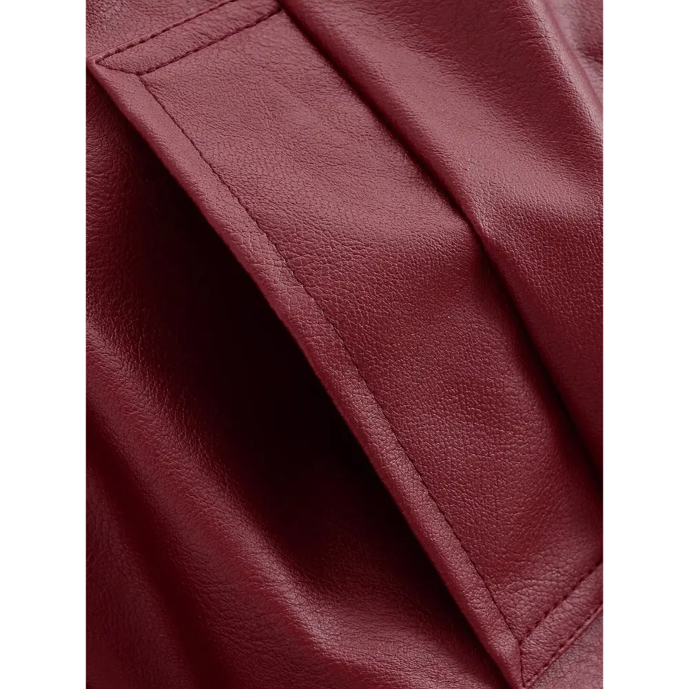 Close-up of welt pocket stitching and faux leather texture