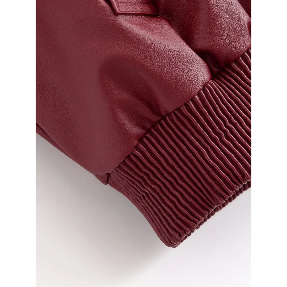 Close-up of ribbed hem and leather body