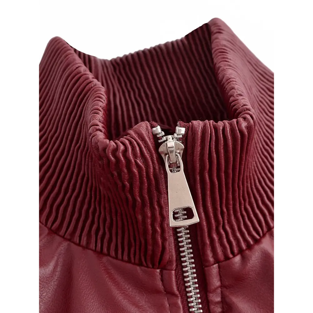 Close-up of metal zipper pull and ribbed collar