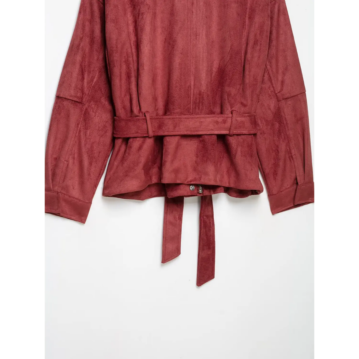 Close-up of back belt, hem and lower zip