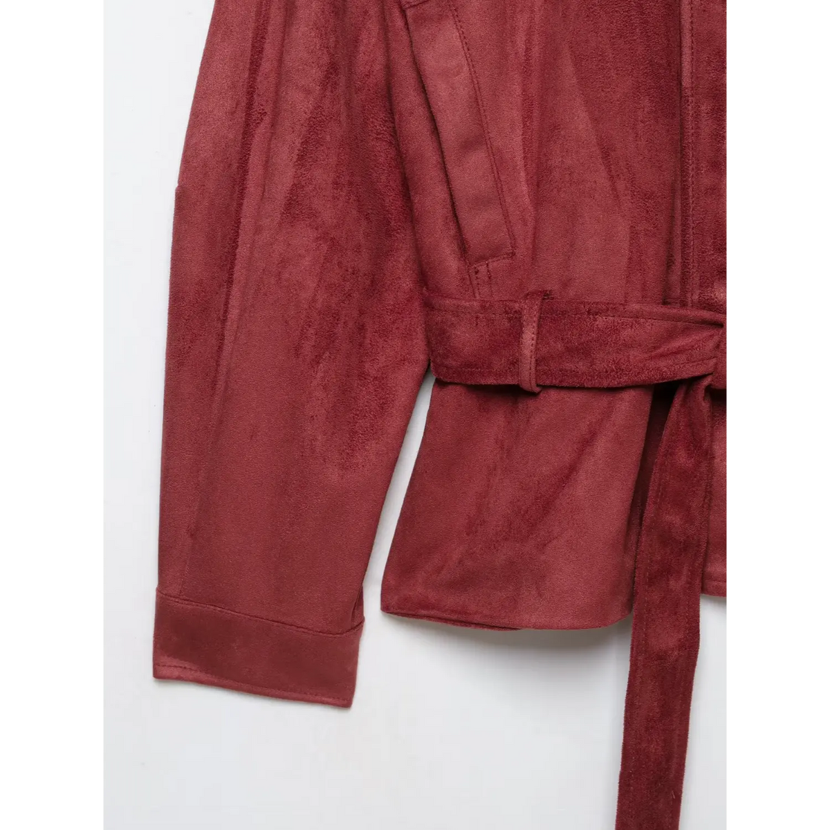 Close-up of side pocket, belt and folded cuff