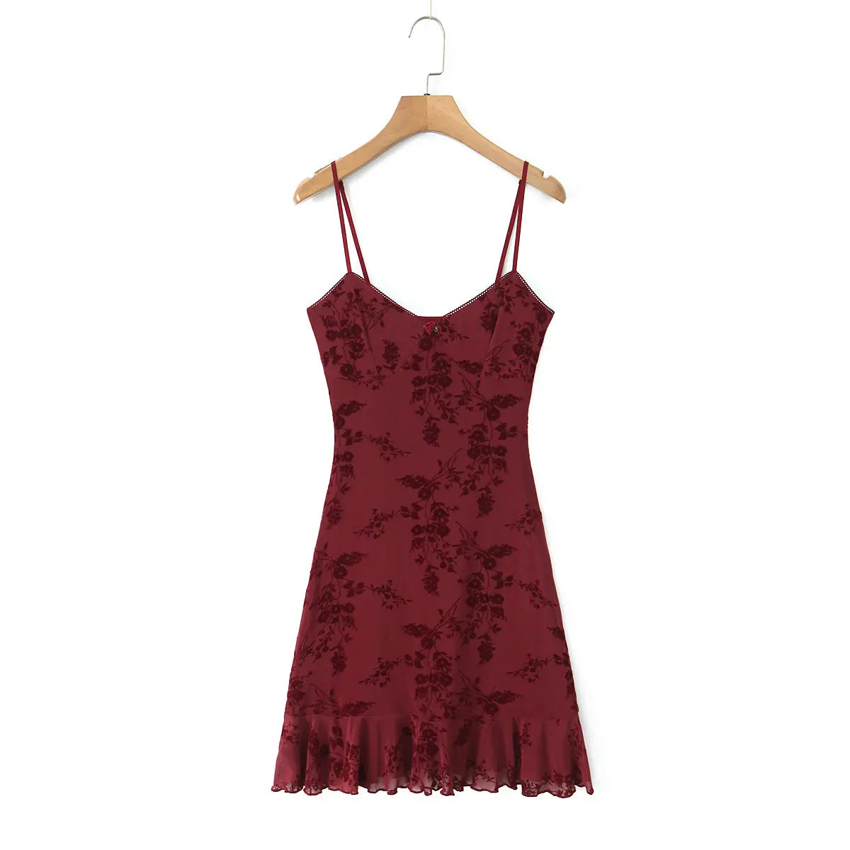 Full front view of the burgundy floral cami dress on a wooden hanger.