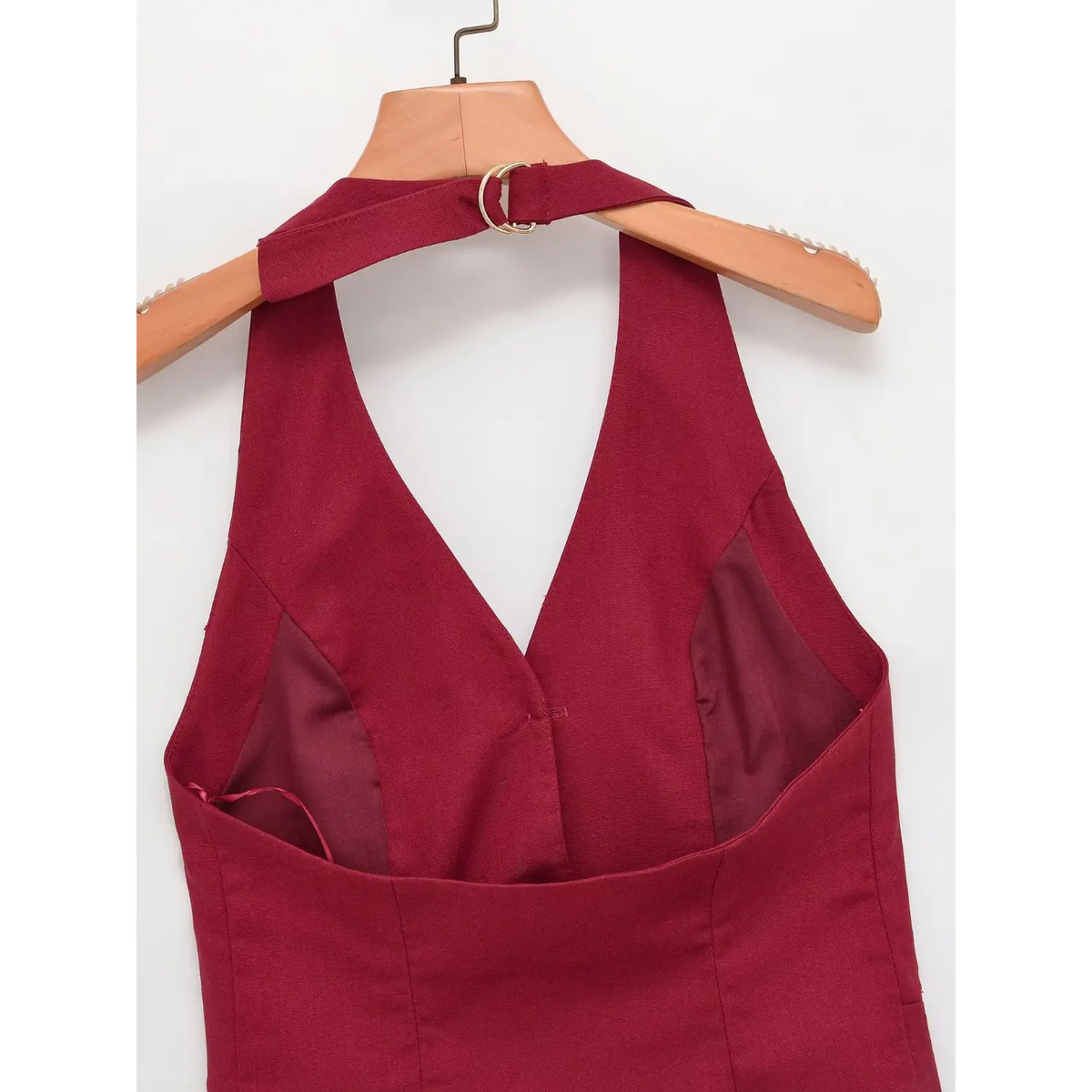 Burgundy halter vest back hanging on hanger