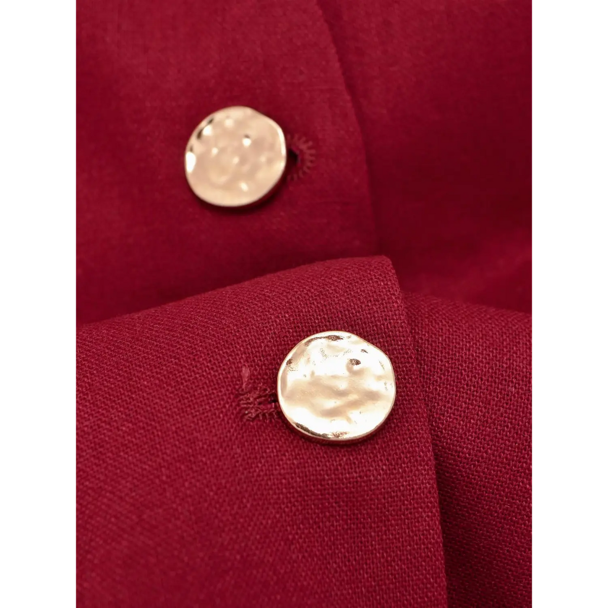 Close-up of textured gold metal buttons